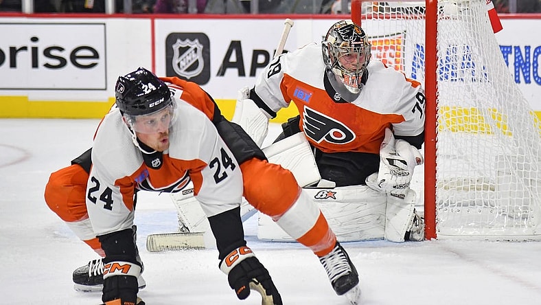 Oct 19, 2023; Philadelphia, Pennsylvania, USA; Philadelphia Flyers defenseman Nick Seeler (24) defends with goaltender Carter Hart (79) against the Edmonton Oilers during the second period at Wells Fargo Center. Mandatory Credit: Eric Hartline-USA TODAY Sports