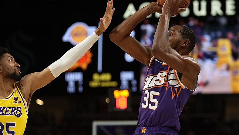 Oct 19, 2023; Palm Desert, California, USA; Phoenix Suns forward Kevin Durant (35) shoots the ball over Los Angeles Lakers forward Christian Wood (35) during the first quarter at Acrisure Arena. Mandatory Credit: Kiyoshi Mio-USA TODAY Sports