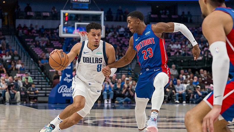 Oct 20, 2023; Dallas, Texas, USA; Dallas Mavericks guard Josh Green (8) moves the ball past Detroit Pistons guard Jaden Ivey (23) during the first quarter at the American Airlines Center. Mandatory Credit: Jerome Miron-USA TODAY Sports