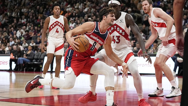 Oct 20, 2023; Toronto, Ontario, CAN; Washington Wizards forward Deni Avdija (8) drives to the net against Toronto Raptors forward Pascal Siakam (43) during the second half at Scotiabank Arena. Mandatory Credit: John E. Sokolowski-USA TODAY Sports