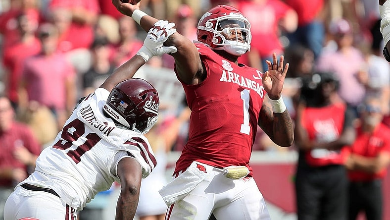 Oct 21, 2023; Fayetteville, Arkansas, USA;  Mississippi State Bulldogs defensive end Deonte Anderson (91) hits the arm of Arkansas Razorbacks quarterback KJ Jefferson (1) during the second half by at Donald W. Reynolds Razorback Stadium. Mississippi State won 7-3. Mandatory Credit: Nelson Chenault-USA TODAY Sports