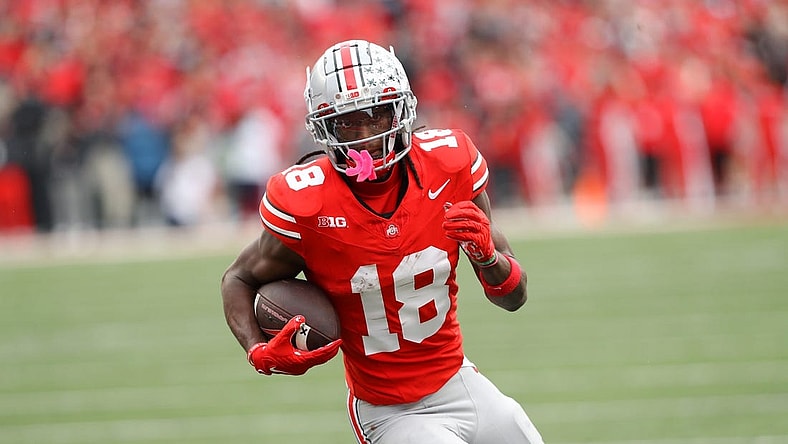 Oct 21, 2023; Columbus, Ohio, USA;  Ohio State Buckeyes wide receiver Marvin Harrison Jr. (18) scores a touchdown against the Penn State Nittany Lions during the fourth quarter at Ohio Stadium. Mandatory Credit: Joseph Maiorana-USA TODAY Sports