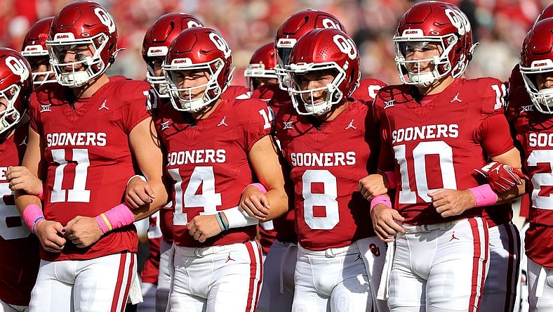 OU's Davis Beville (11), General Booty (14), Oklahoma's Dillon Gabriel (8) and Jackson Arnold (10) link arms before the college football game between the University of Oklahoma Sooners and the University of Central Florida Knights at the Gaylord Family Oklahoma Memorial Stadium in Norman, Okla., Saturday, Oct., 21, 2023.