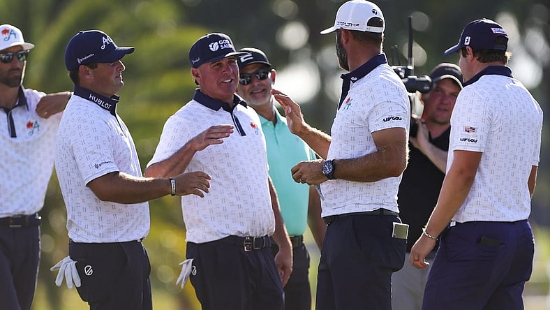 Oct 21, 2023; Doral, Florida, USA; Dustin Johnson celebrates with teammates Patrick Reed, Pat Perez and Peter Uihlein during the second round of the LIV Golf Miami golf tournament at Trump National Doral. Mandatory Credit: Sam Navarro-USA TODAY Sports