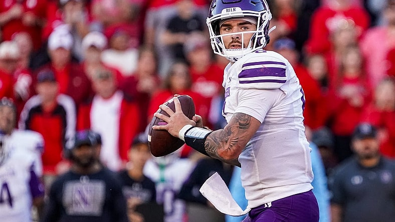 Oct 21, 2023; Lincoln, Nebraska, USA; Northwestern Wildcats quarterback Brendan Sullivan (6) looks for a pass against the Nebraska Cornhuskers during the fourth quarter at Memorial Stadium. Mandatory Credit: Dylan Widger-USA TODAY Sports