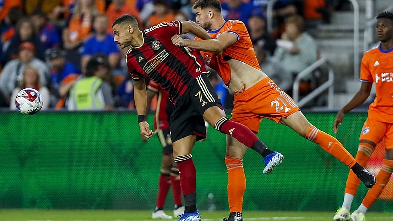 Oct 21, 2023; Cincinnati, Ohio, USA; Atlanta United FC forward Giorgos Giakoumakis (7) battles for the ball against FC Cincinnati defender Matt Miazga (21) in the second half at TQL Stadium. Mandatory Credit: Katie Stratman-USA TODAY Sports