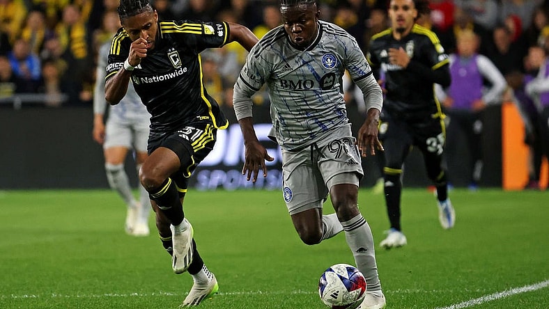 Oct 21, 2023; Columbus, Ohio, USA; CF Montreal forward Kwadwo Opoku (90) controls the ball against Columbus Crew defender Steven Moreira (31) during the second half at Lower.com Field. Mandatory Credit: Trevor Ruszkowski-USA TODAY Sports