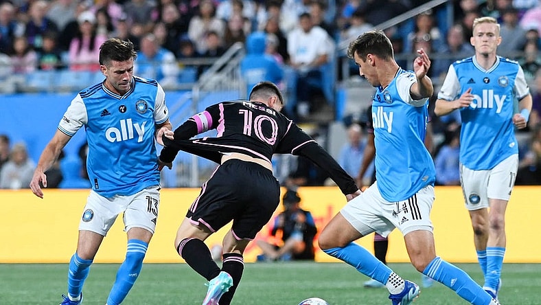 Oct 21, 2023; Charlotte, North Carolina, USA; Charlotte FC midfielder Brandt Bronico (13) battles for the ball against Inter Miami CF forward Lionel Messi (10) against Charlotte FC midfielder Andrew Privett (34) during the first half at Bank of America Stadium. Mandatory Credit: Griffin Zetterberg-USA TODAY Sports