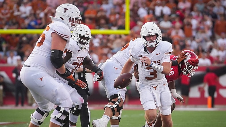 Texas quarterback Quinn Ewers (3) carries the ball in the third quarter of the Texas Longhorn's game against the Cougars at TDECU Stadium in Houston, Saturday, Oct. 21, 2023.