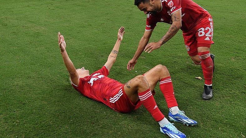 Oct 21, 2023; Nashville, Tennessee, USA; New York Red Bulls defender John Tolkin (47) celebrates with midfielder Luquinhas (82) after Tolkin   s goal in extra time against the Nashville SCat Geodis Park. Mandatory Credit: Christopher Hanewinckel-USA TODAY Sports
