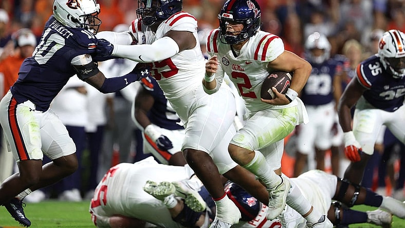 Oct 21, 2023; Auburn, Alabama, USA;  Mississippi Rebels quarterback Jaxson Dart (2) carries against the Auburn Tigers during the first quarter at Jordan-Hare Stadium. Mandatory Credit: John Reed-USA TODAY Sports