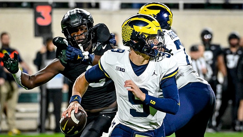 Michigan's J.J. McCarthy looks to throw against Michigan State during the first quarter on Saturday, Oct. 21, 2023, at Spartan Stadium in East Lansing.