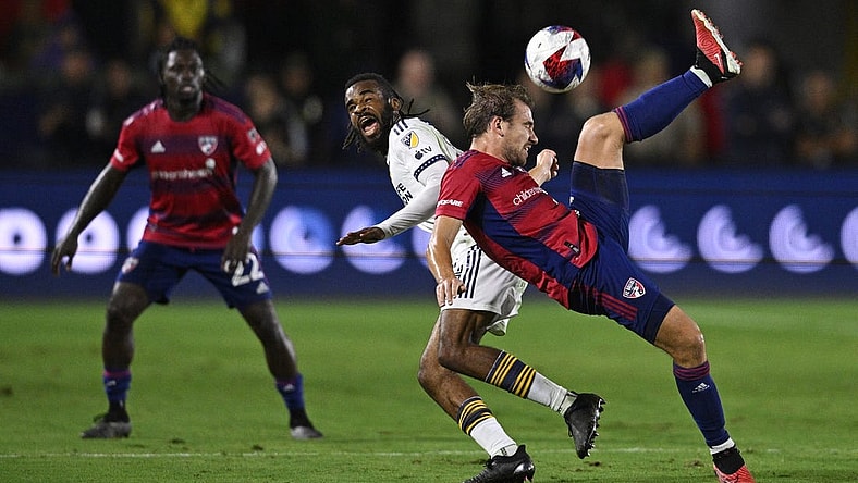 Oct 21, 2023; Carson, California, USA; FC Dallas midfielder Paxton Pomykal (19) plays the ball against Los Angeles Galaxy forward Raheem Edwards (44) during the second half at Dignity Health Sports Park. Mandatory Credit: Kelvin Kuo-USA TODAY Sports