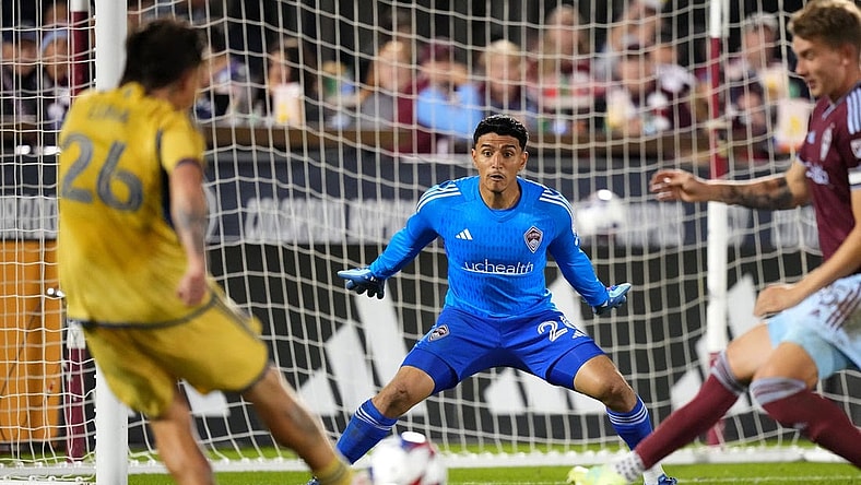 Oct 21, 2023; Commerce City, Colorado, USA; Real Salt Lake midfielder Diego Luna (26) shoots and scores on Colorado Rapids goalkeeper Abraham Rodriguez (26) and in the second half at Dick's Sporting Goods Park. Mandatory Credit: Ron Chenoy-USA TODAY Sports