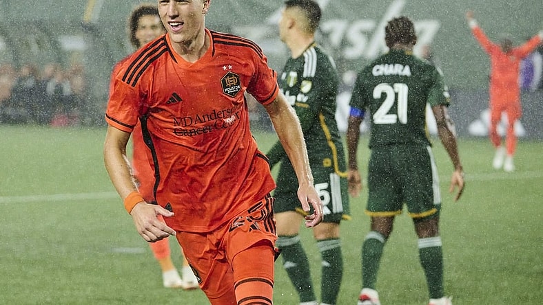 Oct 21, 2023; Portland, Oregon, USA; Houston Dynamo midfielder Griffin Dorsey (25) celebrates after scoring a goal in the second half against the Portland Timbers at Providence Park. Mandatory Credit: Troy Wayrynen-USA TODAY Sports
