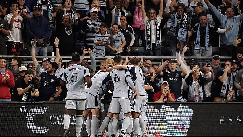 Oct 21, 2023; Kansas City, Kansas, USA; Sporting Kansas City forward Johnny Russell (7) celebrates with teammates after scoring a goal against Minnesota United during the first half at Children's Mercy Park. Mandatory Credit: Denny Medley-USA TODAY Sports