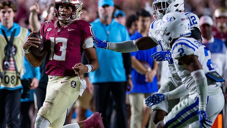 Florida State Seminoles quarterback Jordan Travis (13) runs out of bounds. The Florida State Seminoles defeated the Duke Blue Devils 38-20 on Saturday, Oct. 21, 2023.