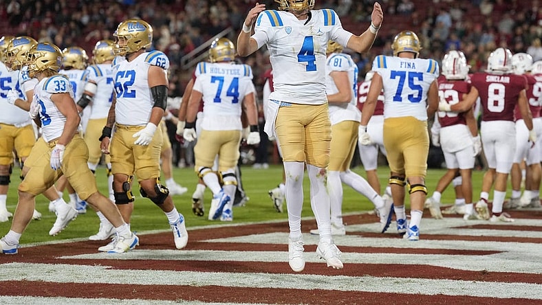 Oct 21, 2023; Stanford, California, USA; UCLA Bruins quarterback Ethan Garbers (4) reacts after a touchdown by running back Carson Steele (not shown) during the second quarter against the Stanford Cardinal at Stanford Stadium. Mandatory Credit: Darren Yamashita-USA TODAY Sports