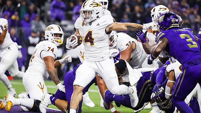 Oct 21, 2023; Seattle, Washington, USA; Arizona State Sun Devils running back Cameron Skattebo (4) rushes for a touchdown against the Washington Huskies during the second quarter at Alaska Airlines Field at Husky Stadium. Mandatory Credit: Joe Nicholson-USA TODAY Sports