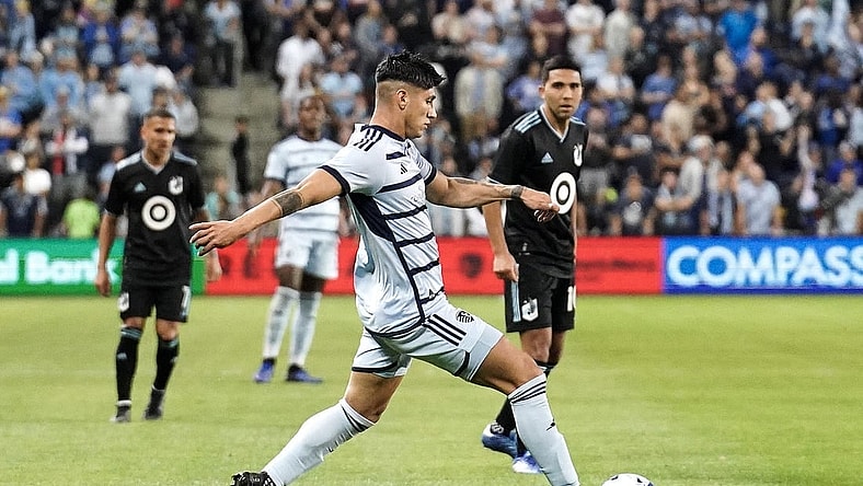 Oct 21, 2023; Kansas City, Kansas, USA; Sporting Kansas City forward Alan Pulido (9) dribbles the ball against Minnesota United during the second half at Children's Mercy Park. Mandatory Credit: Denny Medley-USA TODAY Sports