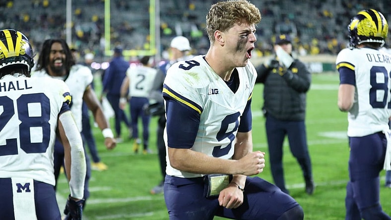 Michigan Wolverines quarterback J.J. McCarthy (9) celebrates after a touchdown against the Michigan State Spartans during second-half action at Spartan Stadium in East Lansing on Saturday, Oct. 21, 2023.