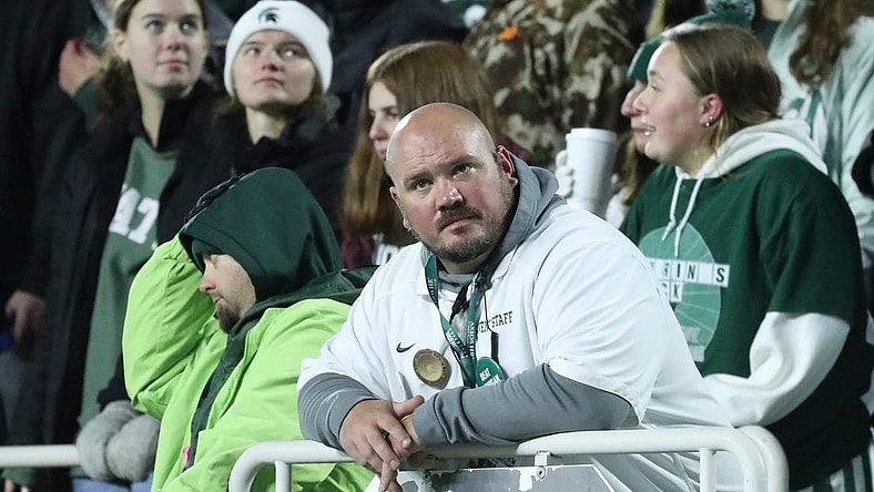A Michigan State fan in the stands during the second half of the Spartans' 49-0 loss to the Michigan Wolverines at Spartan Stadium in East Lansing on Saturday, Oct. 21, 2023.