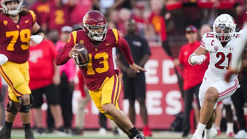 Oct 21, 2023; Los Angeles, California, USA; Southern California Trojans quarterback Caleb Williams (13) carries the ball against the Utah Utes in the first half at United Airlines Field at Los Angeles Memorial Coliseum. Mandatory Credit: Kirby Lee-USA TODAY Sports