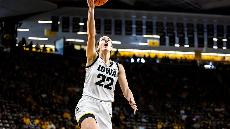 Iowa guard Caitlin Clark (22) makes a basket during a NCAA women's basketball exhibition game between Iowa and Clarke University, Sunday, Oct. 22, 2023, at Carver-Hawkeye Arena in Iowa City.
