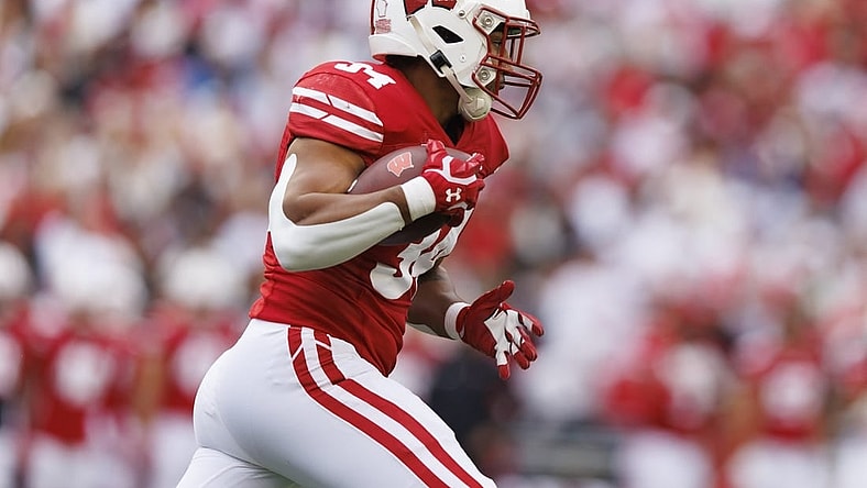 Oct 14, 2023; Madison, Wisconsin, USA;  Wisconsin Badgers running back Jackson Acker (34) during the game against the Iowa Hawkeyes at Camp Randall Stadium. Mandatory Credit: Jeff Hanisch-USA TODAY Sports
