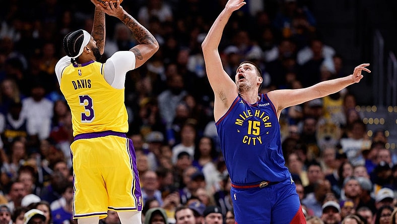 Oct 24, 2023; Denver, Colorado, USA; Los Angeles Lakers forward Anthony Davis (3) attempts a shot as Denver Nuggets center Nikola Jokic (15) guards in the second quarter at Ball Arena. Mandatory Credit: Isaiah J. Downing-USA TODAY Sports