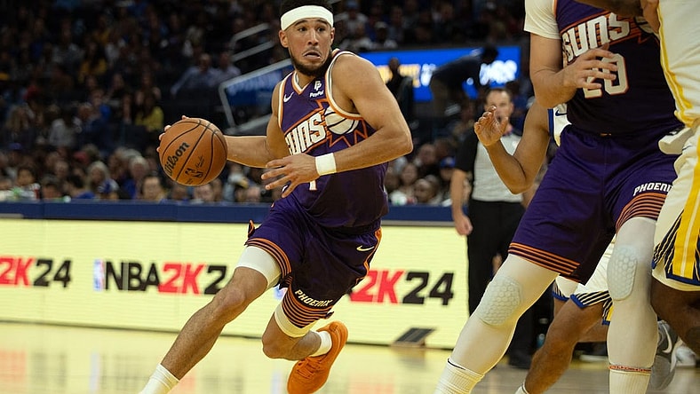 Oct 24, 2023; San Francisco, California, USA; Phoenix Suns guard Devin Booker (1) drives to the basket against the Golden State Warriors during the second quarter at Chase Center. Mandatory Credit: D. Ross Cameron-USA TODAY Sports