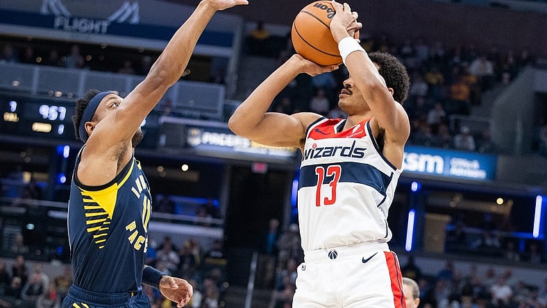 Oct 25, 2023; Indianapolis, Indiana, USA; Washington Wizards guard Jordan Poole (13) shoots the ball while Indiana Pacers guard Bennedict Mathurin (00) defends in the first quarter at Gainbridge Fieldhouse. Mandatory Credit: Trevor Ruszkowski-USA TODAY Sports