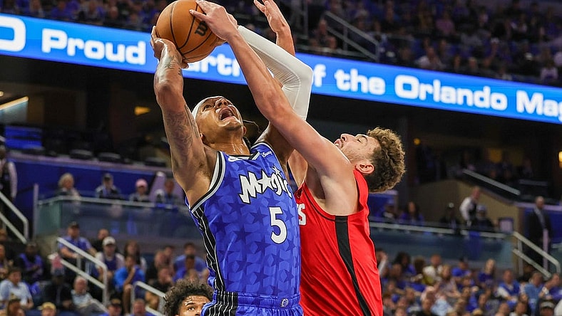 Oct 25, 2023; Orlando, Florida, USA; Orlando Magic forward Paolo Banchero (5) is fouled by Houston Rockets center Alperen Sengun (28) during the first quarter at Amway Center. Mandatory Credit: Mike Watters-USA TODAY Sports