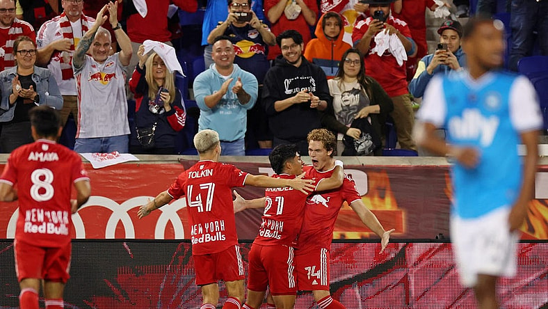 Oct 25, 2023; Harrison, NJ, USA; New York Red Bulls forward Tom Barlow (74) celebrates with midfielder Omir Fernandez (21) after scoring a goal against Charlotte FC during the second half in the Eastern Conference Wild Card match of the 2023 MLS Cup Playoffs at Red Bull Arena. Mandatory Credit: Vincent Carchietta-USA TODAY Sports