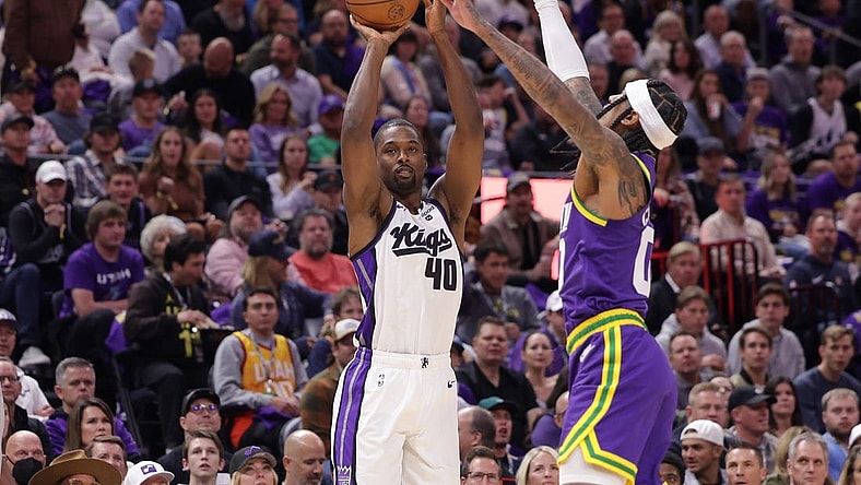Oct 25, 2023; Salt Lake City, Utah, USA;  Sacramento Kings forward Harrison Barnes (40) shoots the ball past Utah Jazz guard Jordan Clarkson (00) during the first quarter at Delta Center. Mandatory Credit: Chris Nicoll-USA TODAY Sports