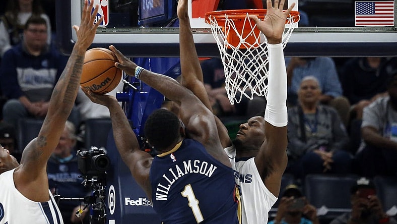 Oct 25, 2023; Memphis, Tennessee, USA; Memphis Grizzlies forward-center Jaren Jackson Jr. (13) defends as New Orleans Pelicans forward Zion Williamson (1) drives to the basket during the first half at FedExForum. Mandatory Credit: Petre Thomas-USA TODAY Sports