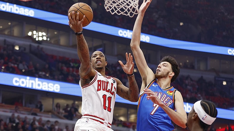 Oct 25, 2023; Chicago, Illinois, USA; Chicago Bulls forward DeMar DeRozan (11) goes to the basket against Oklahoma City Thunder forward Chet Holmgren (7) during the first half of a basketball game at United Center. Mandatory Credit: Kamil Krzaczynski-USA TODAY Sports