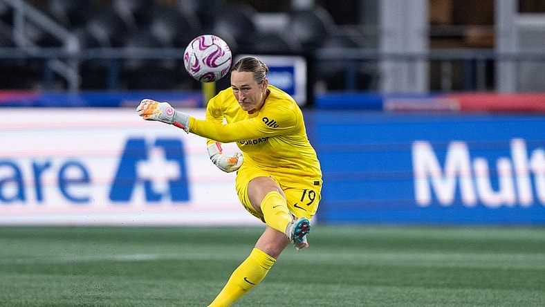 Oct 20, 2023; Seattle, Washington, USA; Angel City FC goalkeeper Angelina Anderson (19) clears the ball against OL Reign at Lumen Field. Mandatory Credit: Stephen Brashear-USA TODAY Sports