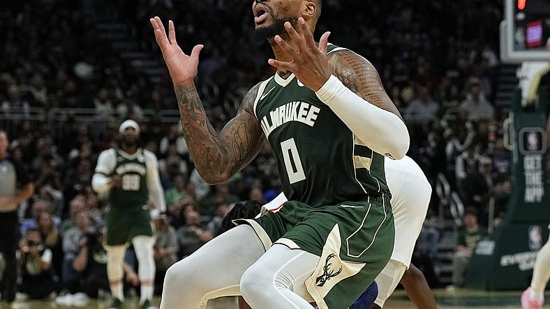 Oct 26, 2023; Milwaukee, Wisconsin, USA;  Milwaukee Bucks guard Damian Lillard (0) reacts after being called for a foul during the third quarter against the Philadelphia 76ers at Fiserv Forum. Mandatory Credit: Jeff Hanisch-USA TODAY Sports