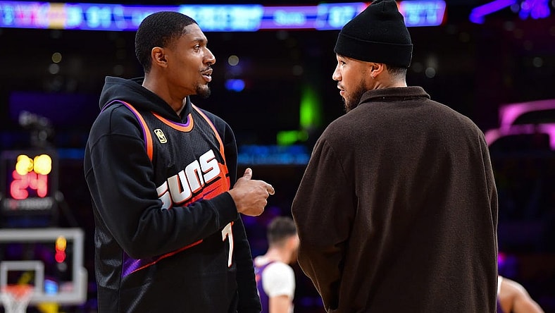 Oct 26, 2023; Los Angeles, California, USA; Phoenix Suns guard Bradley Beal (3) speaks with guard Devin Booker (1) during the second half at Crypto.com Arena. Mandatory Credit: Gary A. Vasquez-USA TODAY Sports