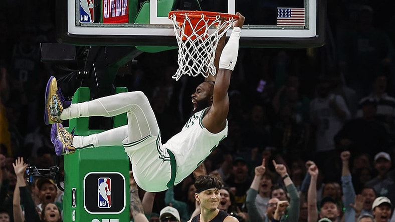 Oct 27, 2023; Boston, Massachusetts, USA; Boston Celtics guard Jaylen Brown (7) shouts out after dunking over Miami Heat guard Tyler Herro (14) during the second quarter at TD Garden. Mandatory Credit: Winslow Townson-USA TODAY Sports