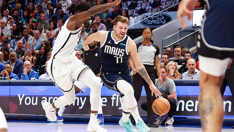 Oct 27, 2023; Dallas, Texas, USA; Dallas Mavericks guard Luka Doncic (77) drives on Brooklyn Nets forward Dorian Finney-Smith (28) during the second quarter at American Airlines Center. Mandatory Credit: Andrew Dieb-USA TODAY Sports