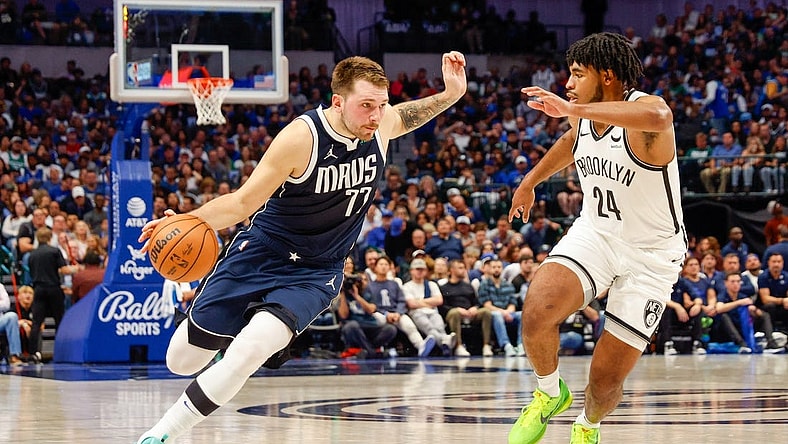 Oct 27, 2023; Dallas, Texas, USA; Dallas Mavericks guard Luka Doncic (77) drives on Brooklyn Nets guard Cam Thomas (24) during the second quarter at American Airlines Center. Mandatory Credit: Andrew Dieb-USA TODAY Sports