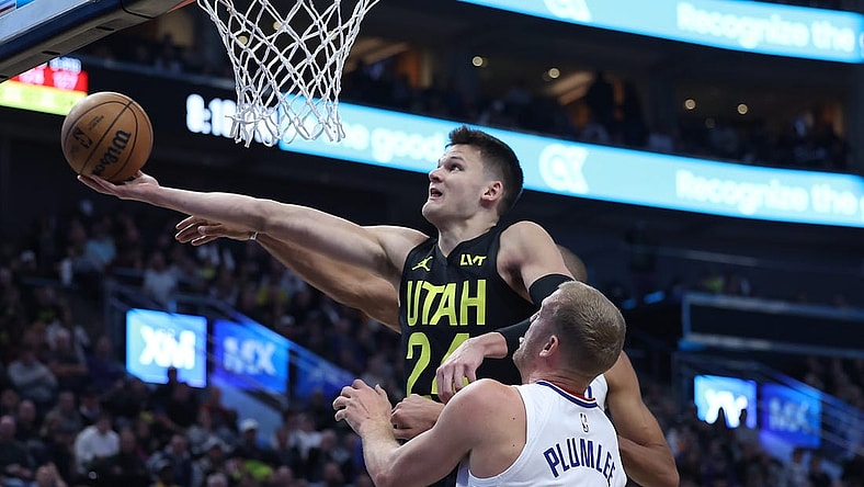 Oct 27, 2023; Salt Lake City, Utah, USA; Utah Jazz center Walker Kessler (24) goes to the basket against Los Angeles Clippers center Mason Plumlee (44) in the second quarter at Delta Center. Mandatory Credit: Rob Gray-USA TODAY Sports