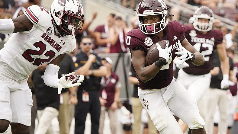 Oct 28, 2023; College Station, Texas, USA; Texas A&M Aggies wide receiver Ainias Smith (0) runs for a touchdown against the South Carolina Gamecocks during the second quarter at Kyle Field. Mandatory Credit: Dustin Safranek-USA TODAY Sports