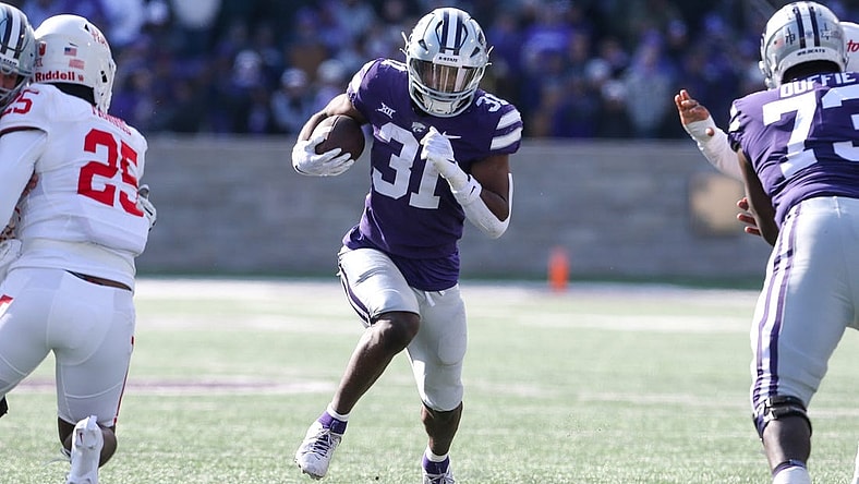 Oct 28, 2023; Manhattan, Kansas, USA; Kansas State Wildcats running back DJ Giddens (31) runs the ball during the first quarter against the Houston Cougars at Bill Snyder Family Football Stadium. Mandatory Credit: Scott Sewell-USA TODAY Sports