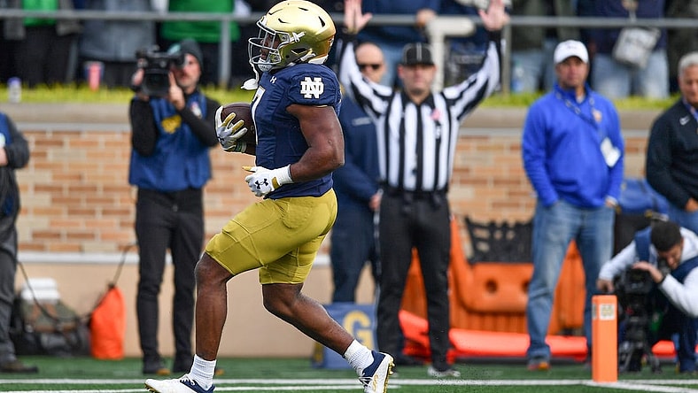 Oct 28, 2023; South Bend, Indiana, USA; Notre Dame Fighting Irish running back Audric Estime (7) scores against the Pittsburgh Panthers in the second quarter at Notre Dame Stadium. Mandatory Credit: Matt Cashore-USA TODAY Sports
