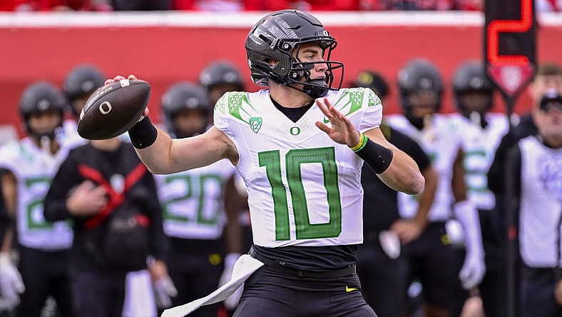 Oct 28, 2023; Salt Lake City, Utah, USA; Oregon Ducks quarterback Bo Nix (10) throws the ball downfield against the Utah Utes during the first half at Rice-Eccles Stadium. Mandatory Credit: Christopher Creveling-USA TODAY Sports