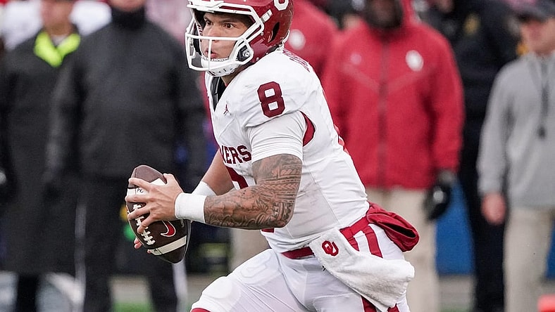 Oct 28, 2023; Lawrence, Kansas, USA; Oklahoma Sooners quarterback Dillon Gabriel (8) runs the ball against the Kansas Jayhawks during the first half at David Booth Kansas Memorial Stadium. Mandatory Credit: Denny Medley-USA TODAY Sports