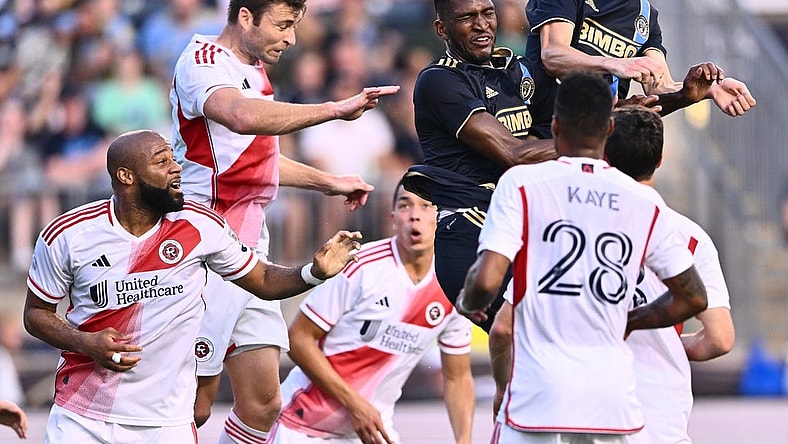 Oct 28, 2023; Philadelphia, PA, USA; New England Revolution defender Dave Romney (2) goes up for a header with Philadelphia Union defender Damion Lowe (17) and Philadelphia Union defender Jack Elliott (3) during the first half in game one in a round one match of the 2023 MLS Cup Playoffs at Subaru Park. Mandatory Credit: Kyle Ross-USA TODAY Sports
